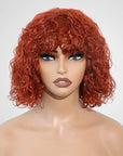 vibrant ginger orange water wave short bob wig with bangs
