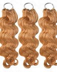 body wave curled honey blonde color crochet braids 3 packs