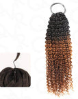 Crochet human hair extension with small kinky curls in ombre black to brown, shown in close-up view.