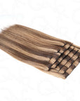 natural-looking clip in extensions with warm brown and blonde tones
